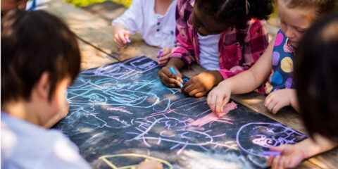 Children drawing art class outdoors
