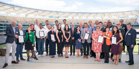 A group of people at Optus stadium with Curtinnovation Awards