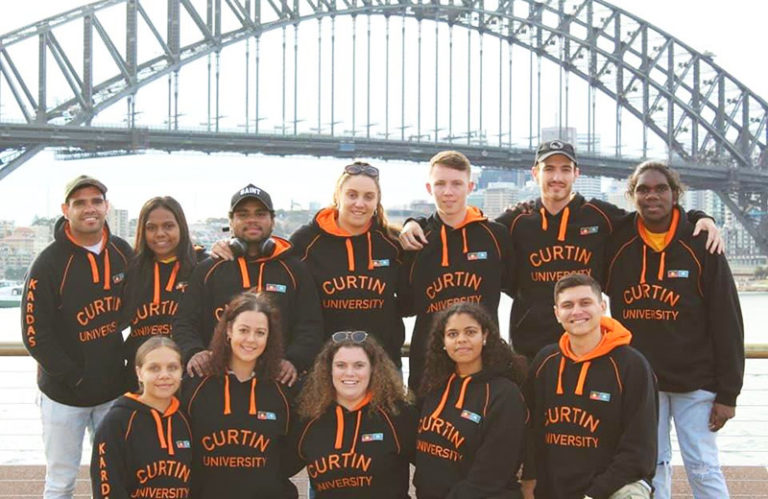 Deadly Kardaz sports team in front of the Sydney Harbour Bridge